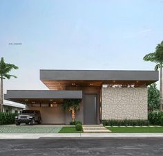 a car is parked in front of a modern house with palm trees and grass around it