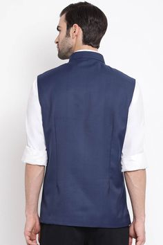 Casual Cotton Silk Navy Blue Nehru Jacket Semi-formal Sleeveless Outerwear With Button Closure, Blue Button-up Vest With Buttons, Formal Sleeveless Cotton Outerwear, Semi-formal Sleeveless Outerwear With Pockets, Semi-formal Sleeveless Blazer With Buttons, Navy Sleeveless Vest With Pockets, Blue Button-up Vest With Button Closure, Blue Buttoned Vest For Fall, Blue Button-up Vest