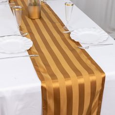 the table is set with glasses and plates