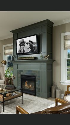 a living room filled with furniture and a flat screen tv mounted above a fire place