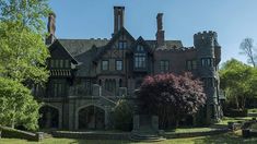 an old castle like building in the middle of a park