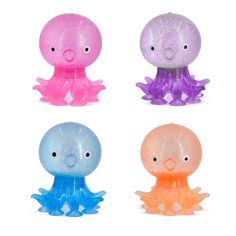 four different colored jellyfish toys sitting next to each other