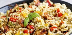 a close up of a plate of food with rice and vegetables