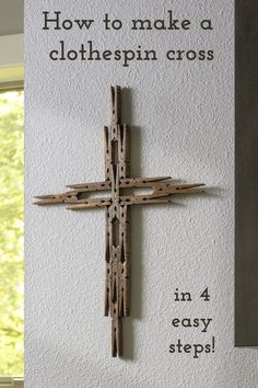 a wooden cross mounted to the side of a wall with text overlay that reads how to make a clothespin cross in 4 easy steps