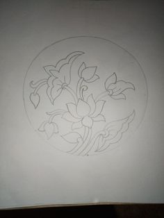 a drawing of flowers in a circle on a white sheet of paper with black ink