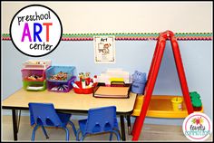 an art center with chairs and desks for children to sit at the table in front of it