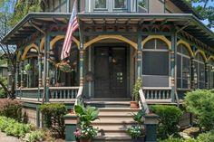 a house with an american flag on the front porch