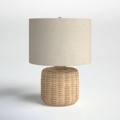 a wicker table lamp on a white background