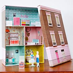 the doll house is made out of cardboard