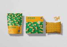 two bags of dog treats next to each other on a gray surface with yellow and green polka dots