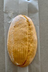 a piece of bread sitting on top of a plastic bag