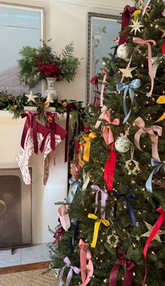 a christmas tree decorated with ribbons and ornaments