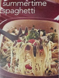 a cookbook with spaghetti and vegetables in it