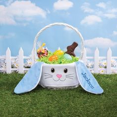 an easter basket with bunny ears and eggs in it