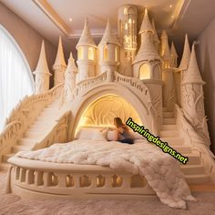 a woman is sitting on a bed made to look like a castle