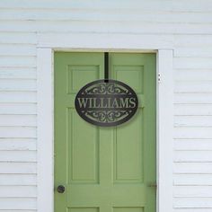 a green door with the name williams on it