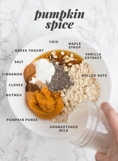 the ingredients for pumpkin spice in a white bowl on a marble counter top with text overlay