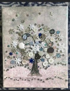 a tree made out of buttons on a white and blue background with snowflakes