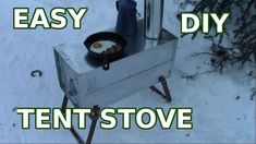 an outdoor stove with eggs cooking on it in the snow, and words that read easy diy tent stove