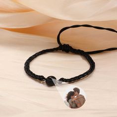 This is a mysterious bracelets, Personalized for the moment you love most on a projection bracelets! Engraved love never fades, and treasured memory will always be with you. Carry your Little cute photo hidden in the pendant, You can see the photo inside the pendant, or you can use it to illuminate the light and project your photo on the wall. The best dreamy gift for yourself and family, and friends. Customize Your Picture Projection Bracelets You can freely customize anything you like, including people, pets, scenery, and even symbol, and attach text as a souvenir. Please try to upload photos with high resolution, the higher the resolution, the more obvious the product effect. Meaningful Accessory & Memorial Gift This customized projection bracelets engraved with your favorite photo will Adjustable Black Promise Bracelet, Adjustable Black Bracelet For Promise, Black Adjustable Promise Bracelet, Couples' Black Promise Bracelets, Adjustable Black Bracelets For Anniversary, Black Couples Bracelet Jewelry, Personalized Black Wristband For Gift, Personalized Black Wristband Gift, Black Adjustable Couples Bracelets