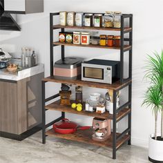 a kitchen with a microwave, toaster and other items on the shelves next to a potted plant