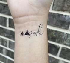 a small tattoo on the wrist that says in english