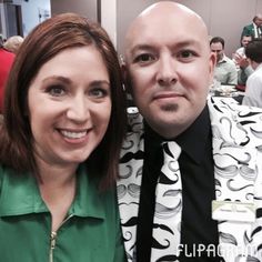 a man and woman are posing for a photo