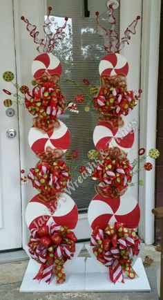 a door decorated with candy canes and bows