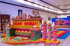 an elaborately decorated display in the lobby of a building with lots of decorations on it