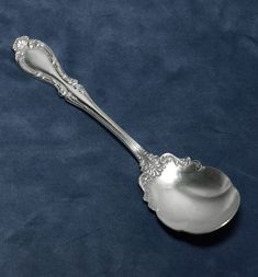 a silver spoon on a blue background