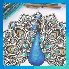 a peacock is sitting on top of a coloring book with colored pencils next to it