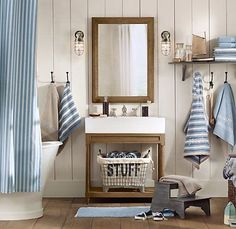 a bathroom with blue and white striped shower curtain