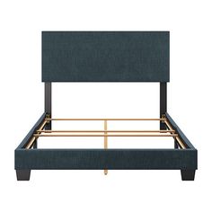 an upholstered bed frame with gold legs and headboard, in blue fabric