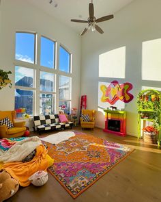 a living room filled with furniture and large windows