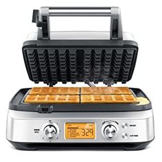 the waffle maker has two plates on it and is ready to be used for breakfast