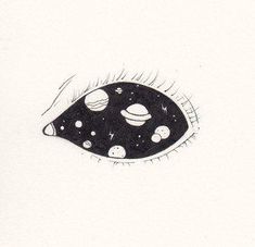 a drawing of an eye with planets on it