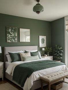 a bedroom with green walls and white bedding