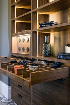 a wooden desk with drawers and books on it