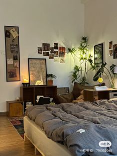 an unmade bed sitting on top of a hard wood floor