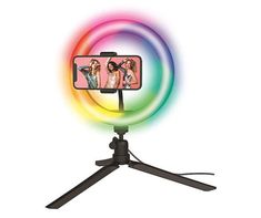 a cell phone sitting on top of a tripod with a rainbow light behind it