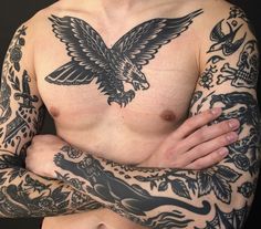 a man with tattoos on his arms and chest