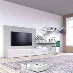 a living room with a large flat screen tv on the wall