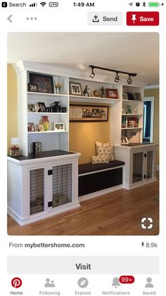 an image of a living room with bookshelves and dog crates on the wall