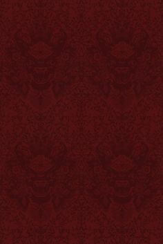 a red wallpaper with an ornate design