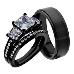 two black wedding rings with princess cut diamonds on each one and side stones in the middle