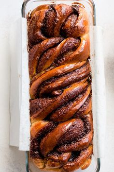 a loaf of cinnamon buns in a glass baking dish