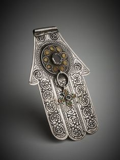 Morocco - 1890s. Silver 'Hand of Fatima' or 'khamsa' (meaning 'five') amuletic pendant in the shape of a hand.silver,glass, enamel . British Museum, Ancient Art, Hand Decorated, Glass Set