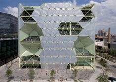 an aerial view of the exterior of a building with many windows and stars on it