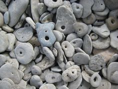 rocks with holes in them are piled on top of each other