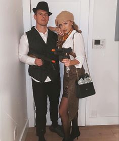 a man and woman dressed up in costumes